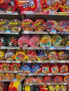 many different types of candy on display in a store