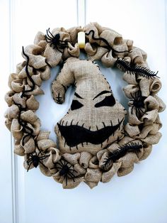 a burlock wreath with a scary face on it