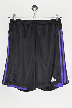 "Adidas sport shorts in black and purple, with leggings. - Size tag: Please always check measurements before buying. Men's L - Measurements (laying flat): Waist: 13\" stretches to 20.5\"   Outleg: 18.5\" Inleg: 8.5\" Thigh: 14\" Rise: 13\" Leg opening: 11.5\" -Wear: /Please see images for details/ Good used condition. Small fabric pulls and a snag as shown on the pictures. - Fabric: Polyester, Spandex *All of our items are preloved pieces so some signs of natural wear and age are to be expected. Please look through the photos carefully to check if the condition is to your satisfaction. *All efforts are made to show any defects however small imperfections may be missed. *We try to describe the sizes as accurately as possible, but please keep in mind that sizes nowadays can differ to sizes u Cheap Adidas Athletic Shorts For Sports, Sporty Purple Athletic Shorts With Built-in Shorts, Sporty Stretch Purple Athletic Shorts, Purple Stretch Athletic Shorts For Sports, Purple Stretch Sporty Athletic Shorts, Sporty Purple Stretch Athletic Shorts, Purple Short Leg Sports Bottoms, Purple Stretch Athletic Shorts With Moisture-wicking, Purple Moisture-wicking Stretch Athletic Shorts