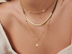 Carry a touch of personal charm with our Capital Letter Initial Necklace, a celebration of individuality and style. This elegant piece features a bold, uppercase initial pendant, polished to a gleaming finish, and suspended on a delicate chain. Whether it's your own initial or that of someone close to your heart, this necklace is a versatile statement of identity, perfect for everyday wear or as a thoughtful, personalized gift. Choose your letter and make a statement that is uniquely yours. Add Letter Necklace Initials, 14k Gold Plated Jewelry, Charm Collection, Capital Letters, Delicate Chain, Bead Chain, Engraved Jewelry, Initial Pendant, Letter Necklace