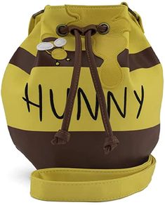 PRICES MAY VARY. Loungefly Winnie the Pooh Honey Pot Crossbody Faux Leather bag Adjustable strap Word Hunny is embroidered Officially licensed Standard Sized Winnie the Pooh Honey Pot Crossbody with Adjustable straps. Loungefly Winnie The Pooh, Winnie The Pooh Honey Pot, Pooh Honey Pot, Winnie The Pooh Honey, Disney Purse, Disney Bound Outfits, Loungefly Bag, Disney Bag, Faux Leather Bag