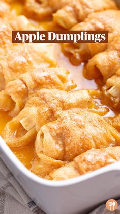 a casserole dish filled with food on top of a cloth covered tablecloth