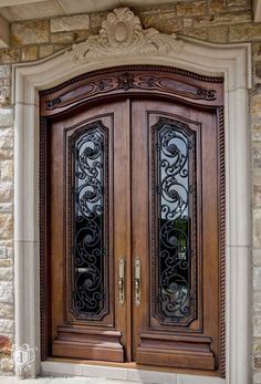 an ornate wooden door with two glass panels on the front and side doors are shown