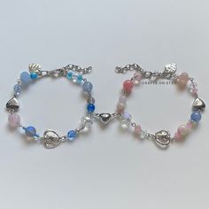 "A sweet handmade bracelet pair Choose your favorite pair to share with a friend, family, a loved one, or wear both lovely bracelets yourself!  ✿ Made with Quartz, glass, glass crystal, and metal accents ✿ Skyline: Pearlescent white, iridescent clear, clear, milky white, sky blue, icy blue, icy pink, azure, clear blue, and silver ✿ Dreamland: Pearlescent white, iridescent clear, clear, milky white, icy pink, icy blue, green, bubblegum, peach, raspberry pink, and silver ✿ The bracelets have an additional 1-1.5\" of extension chain Additional Options ✿ You can mix and match. If you don't change anything about the bracelet, the individual bracelet prices will not change ✿ You can purchase a bracelet individually. You can choose to include the magnetic half-heart or not. ✿ Customize your own b Matching Bracelet Ideas For Best Friends, Silver Glass Crystal Bracelet Gift, Silver Crystal Bracelet With Czech Glass As Gift, Silver Crystal Bracelet With Czech Glass For Gift, Silver Czech Glass Crystal Bracelet As Gift, Adjustable Heart-shaped Crystal Bracelet, Cute Silver Bracelets With Heart Beads, Handmade Glass Crystal Bracelet Gift, Silver Beaded Bracelets With Heart Charm For Friendship