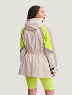 The Basti Parka Coat from The Jogg Concept is a lightweight jacket must-have for the warm season. It is perfect for the outdoors, featuring a relaxed cut, striking neon accents at the shoulders, and two very deep pockets with a snap-button enclosure to keep your essentials secure and dry. The Basti Parka Coat is water-repellent with a removable drawstring hood and a concealed waistband drawstring to stay snug and comfortable while active. Additional Details: Product Type: Parka Coat Colors: Tan Functional Utility Jacket For Spring Outdoor, Functional Utility Jacket For Outdoor Spring Activities, Functional Spring Utility Jacket For Outdoor, Spring Functional Utility Jacket For Outdoor, Nylon Hiking Outerwear With Reflective Details, Reflective Nylon Outerwear For Hiking, Winter Athleisure Outerwear With Reflective Details, Nylon Sporty Utility Jacket For Outdoor Activities, Sporty Parka For Spring Outdoor Activities