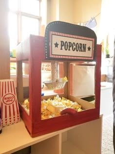 a popcorn machine sitting on top of a table