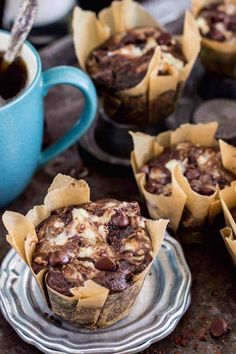 some cupcakes are sitting on a plate