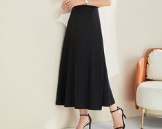 * A elegant midi skirt, made of cotton blends. * Fixed waist with invisible zipper. * Can custom make waist size and skirt length. * Material: Outer-30% cotton, 70% polyester; lining-100% polyester * Size: True to US size, US 0-US 20 are available, you can let us know your usual size and height in your order. * Shipping: Free shipping Processing time : 5-7 Business days Delivery time : 7-20 Business days Tracking number available If you need rush order or expedited shipping, please let us know, Elegant Black A-line Skirt, Black A-line Relaxed Fit Skirt, Black A-line Pleated Maxi Skirt, Black A-line Skirt For Office, Elegant Black Maxi Skirt For Office, Black A-line Skirt For Formal Occasions, Black Relaxed Fit Midi Maxi Skirt, Elegant Black Flared Maxi Skirt, Formal Black Flared Maxi Skirt