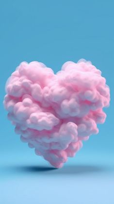 a pink cloud shaped like a heart on a blue background