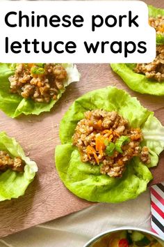 lettuce wraps filled with meat and vegetables on top of a wooden cutting board