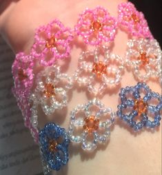 the bracelets are decorated with beads and flowers