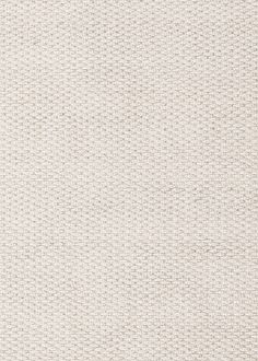 an upholstered white fabric textured with small dots