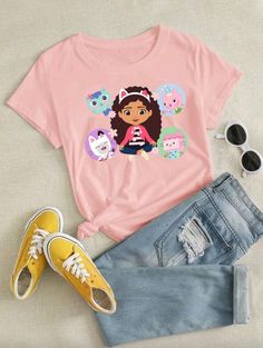 a pink shirt with an image of dora the cat on it and some denim shorts