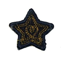 a black and yellow star shaped object on a white background