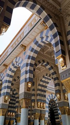 the inside of an ornate building with columns and arches on it's sides,