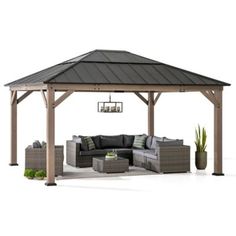 an outdoor living area with couches, tables and a gazebo in the background