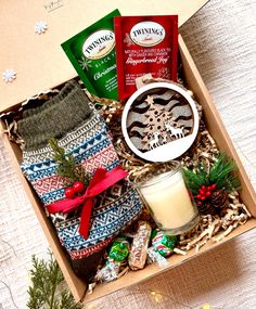 a box filled with christmas treats and candles