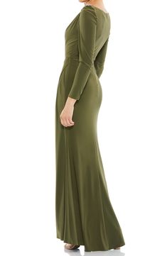 Subtle gathering at the hip and shoulder flatter your figure in an elegant long-sleeve gown finished with twinkling crystals at the shoulder. 63" length Bateau neck Long sleeves Lined 100% polyester Spot clean Imported Fitted Long Sleeve Ruched Evening Dress, Ruched Long Sleeve Maxi Dress With Fitted Bodice, Long Sleeve Ruched Evening Dress, Long Sleeve Ruched Evening Dress For Formal Occasions, Long Sleeve Ruched Maxi Dress For Gala, Ruched Long Sleeve Gown For Gala, Formal Long Sleeve Ruched Evening Dress, Long Sleeve Ruched Evening Dress For Gala, Long Sleeve Ruched Gown With Fitted Bodice