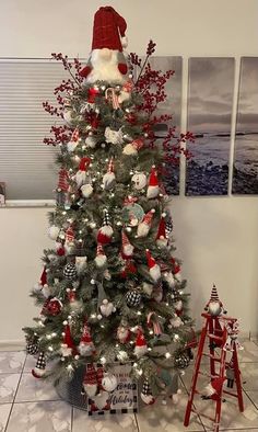 a christmas tree decorated with red, white and blue ornaments