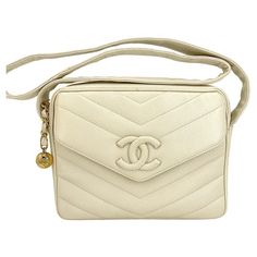 Store item: 68266 We love this Chanel 1995 Vintage Bone Ivory Caviar Envelope Camera Flap Bag Covered CC for its lightweight functionality, yet it's superbly luxurious with the ivory caviar quilts. The front "CC" logo is a large 3-dimensional logo covered in caviar leather. Wide diamond-quilted crossbody messenger strap, leather interior, magnetic button closure and side pocket. Back exterior pocket for phone or essentials storage. In ivory beige caviar leather and 24k gold plated hardware. For Cc Camera, Vintage Chanel Bag, Chanel Brand, Vintage Mushroom, Chanel Vintage, Bag Cover, Cc Logo, Leather Hobo, Vintage Chanel