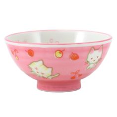 a pink and white bowl with cats on it's side, in front of a white background