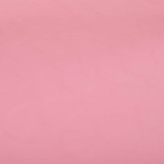 a pink background with small white circles