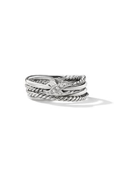 a stack of silver rings with an anchor on the top and one knot at the bottom