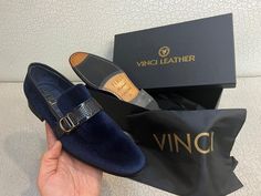 Materials Upper: LeatherLining: LeatherSole : Leather Indulge in refined elegance with our navy-blue men's dress slip-on loafers, featuring a luxurious velvet exterior and a sumptuous all-leather interior and sole. This sophisticated pair combines opulence with comfort, ensuring a lavish experience with every step.The meticulously designed buckle, crafted from genuine patent leather, graces the upper, adding a touch of exclusivity to this already exquisite pair. This unique buckle serves as a sy Luxury Blue Loafers For Business, Luxury Blue Business Loafers, Elegant Blue Loafers For Formal Occasion, Elegant Blue Formal Loafers, Elegant Blue Formal Dress Shoes, Luxury Suede Loafers For Party, Luxury Suede Party Loafers, Elegant Blue Dress Shoes For Semi-formal Occasions, Elegant Suede Loafers For Party