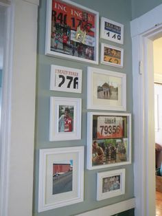 a wall with pictures and numbers on it in a room that is painted blue, green and white