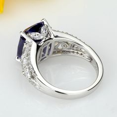 SKU : HBHB15R0609A 12 mm Platinum Plated Silver 6.5 Carat Tanzanite CZ Wedding Engagement Ring for Women MATERIAL: 925 Sterling Silver STONE: Top Quality Simulated Tanzanite PLATING: Platinum plating added to enhance shine and durability Our stones are the highest quality diamond simulants that are polished, finely cut, loupe clean, and have an exactly similar appearance and as beautiful as to naturally occurring diamonds. All cubic zirconia stone weights are approximate and listed as diamond eq Elegant Tanzanite Promise Jewelry, Elegant Tanzanite Jewelry For Promise, Exquisite Silver Jewelry For Promise, Exquisite Silver Sapphire Ring With Cubic Zirconia, Promise Jewelry In White Gold With Tanzanite, Silver Sapphire Ring With Vs Clarity For Promise, Dazzling Silver Sapphire Ring With Vvs Clarity, Silver Sapphire Jewelry With Center Stone, Silver Sapphire Ring With Accent Stones For Promise