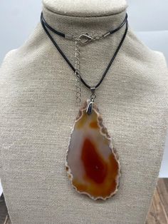 "Slice Agate Pendant: Material: Gemstone Stone: Agate Shape: Pendants Color: Red Item weight: 41 Grams Used for:  It is good to wear with Gold and silver chains in Normal life or on any occasion.  It is handmade. Discover the enchanting beauty of our \"Slice Agate Pendant,\" a handcrafted masterpiece that transcends ordinary jewelry. This agate pendant is more than just an accessory; it's a unique gift for her or him, showcasing the natural elegance of healing crystals. Each agate slice pendant Adjustable Agate Necklace With Large Stone, Adjustable Agate Crystal Necklace With Gemstone, Adjustable Agate Gemstone Crystal Necklace, Agate Crystal Necklace With Large Stone For Gift, Brown Agate Gemstone Crystal Necklace, Adjustable Carnelian Stone Jewelry, Red Agate Crystal Necklace For Healing, Agate Geodes Gemstone Gift, Bohemian Agate Geodes As A Gift