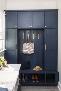 a blue bench with a purse hanging on it