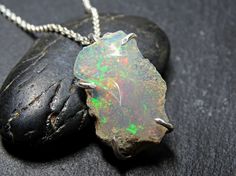 raw opal necklace silver welo opal pendant silver by CrazyAssJD Nickel-free Opal Necklaces As Gift, Nickel-free Opal Necklace Gift, Silver Opal Necklace Gift, Ethiopian Opal Gemstone Jewelry For Gifts, Silver Opal Necklace For Gift, Ethiopian Opal Gemstone Jewelry As Gift, Ethiopian Opal Birthstone Jewelry As Gift, Gift Jewelry With Ethiopian Opal And Natural Stones, Ethiopian Opal Jewelry With Natural Stones As Gift