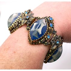 "VTG 1960s Unmarked Selro Panel Bracelet Blue Marbleized Lucite Rhinestone Brass Gold Tone Gorgeous estate find in excellent condition with no missing stones. Measures just over 6.5\" long x 1 1/8\" wide. I buy vintage jewelry and collectibles from estate sales and auctions. Please check out my other items for more special finds." Vintage Adjustable Bracelets With Stones, Antique Blue Bracelet Jewelry, Vintage Blue Bangle Bracelets, Vintage Blue Bracelet For Formal Occasions, Vintage Blue Bracelets For Party, Retro Blue Beaded Jewelry, Blue Beaded Retro Jewelry, Blue Jeweled Bracelet, Blue Jeweled Bangle Jewelry