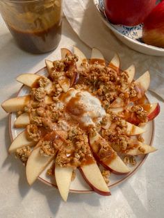 a plate with apples and granola on it