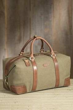 Overland Jarvis Canvas and Leather Duffel Bag | Overland Luxury Travel Bag With Leather Trim For On-the-go, Luxury Travel Bag For On-the-go, Luxury Leather Travel Bag With Canvas Lining, Luxury Travel Luggage With Leather Lining, Luxury Travel Bag With Pockets, Luxury Travel Bags With Handles, Duffel Bag Pattern, Hand Bags Ideas, Leather Duffle Bag Men