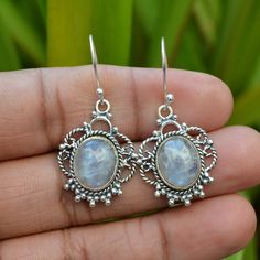 Rainbow Moonstone Earrings, Blue Fire Earrings, Natural Moonstone Earrings, Dangling Earrings, 925 Silver Earring, June Birthstone Jewelry. 》D E T A I L S《 ✦Stone: Natural Rainbow Moonstone ✦Shape: Oval ✦Size: 10x14 mm ✦Weight:- 7.55 Gram ✦SKU: SE-390 》A B O U T S T O N E《 💎 Moonstone is known to have many meanings and one of the overriding reasons for its use is for protection while travelling. ... Historically, moonstone has been said to possess feminine energies and can benefit fertility, love, protection and sleep. 》C U S T O M I Z E O R D E R《 We accept custom and personalized order. It can be change in the gemstone, earrings design and earrings size. Please send us message if you are interested in a custom creation. 》 P A C K A G I N G 《 Your jewelry will be nicely packaged. If one Nickel-free Moonstone Earrings For Gifts, Nickel-free Moonstone Round Earrings, Silver Nickel-free Moonstone Earrings, White Oval Moonstone Earrings, Silver Moonstone Gemstone Earrings, Oval Moonstone Earrings For Gift, Handmade Silver Moonstone Crystal Earrings, Silver Earrings With Moonstone And Natural Stones, Silver Moonstone Earrings With Natural Stones