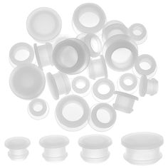 an assortment of white plastic objects on a white background