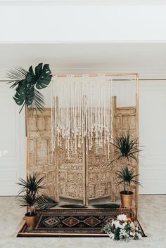 a room decorated with plants and potted plants