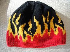 a knitted hat with flames on it