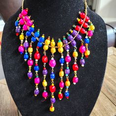 Multicolor Woven Palm Necklace With Earrings Bold Colorful Beads Jewelry Gift, Vibrant Colorful Beaded Jewelry Gift, Vibrant Red Jewelry With Colorful Beads, Bold Multicolor Jewelry For Gifts, Multicolor Costume Jewelry Necklace With Dangling Beads, Multicolor Dangle Necklaces In Costume Jewelry Style, Multicolor Necklaces With Dangling Beads, Vibrant Rainbow Beaded Jewelry, Multicolor Dangling Beads Jewelry For Party