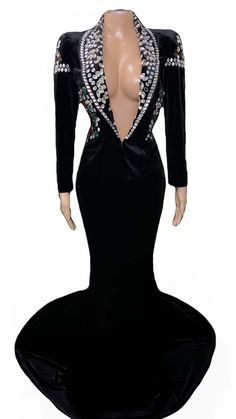 a mannequin wearing a black evening gown