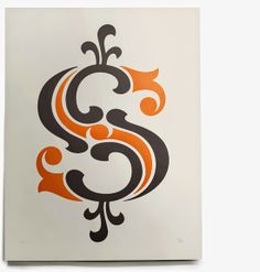 an orange and black letter s is on a white paper with some type of design