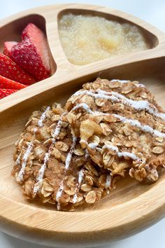 two cookies on a plate with strawberries and oatmeal