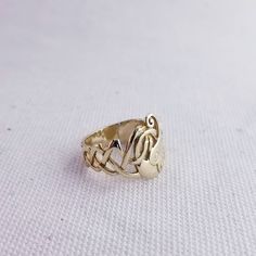 This vintage 10K gold Children of Lir ring is made by TJH of Ireland. The swan motif represents the transformation of the Children of Lir into swans. Size 5 1/4 Stamps: 10K Total Weight: 3.5g Width: 18mm face to 6mm band These pieces are pre-owned vintage jewelry. As this jewelry is not new there may be signs of wear or age. Each piece is sold as-is unless otherwise specified (ex. sizing). We strive to only sell vintage jewelry that is in good wearable condition. As with any jewelry, care and pr Gold Celtic Rings, Celtic Ring, Celtic Rings, Swans, 10k Gold, Vintage Children, Jewelry Care, Vintage Silver, Citrine