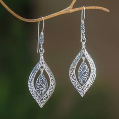 Crafted of sterling silver two baby leaves dangle within larger shapes in this pair of earrings from Bali. Wayan Asmana presents this wonderful accessory which is accentuated by a striking combination of finishes. Elegant Leaf-shaped Sterling Silver Earrings, Hypoallergenic Sterling Silver Leaf-shaped Earrings, Elegant Sterling Silver Leaf-shaped Jewelry, Elegant Leaf-shaped Sterling Silver Jewelry, Elegant Sterling Silver Leaf Jewelry, Silver Leaf-shaped Jewelry With Ear Wire, Nickel Free Sterling Silver Leaf-shaped Earrings, Nickel-free Sterling Silver Leaf-shaped Earrings, Nickel Free Leaf-shaped Sterling Silver Earrings