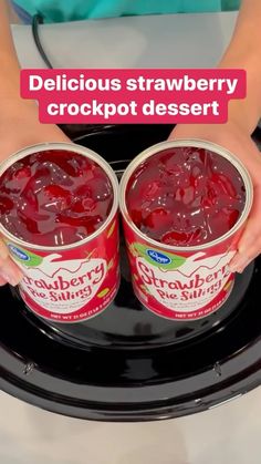 two hands holding two buckets of crockpot dessert