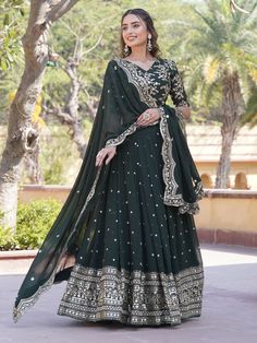 Introducing the epitome of elegance and grace, behold the dark green Georgette lehenga ensemble adorned with intricate sequin and embroidered work, perfect for your mehendi celebrations. Crafted with meticulous attention to detail, this ensemble exudes sophistication and charm, promising to make you the cynosure of all eyes on your special day.
The dark green Georgette lehenga boasts a mesmerizing 3.5-meter flair, ensuring graceful movements with every step you take. Its exquisite sequin and emb Green Georgette Gown With Cutdana Detail, Green Georgette Gown With Cutdana, Green Cutdana Georgette Gown, Green Sets For Eid Reception, Green Anarkali Set For Diwali Reception, Green Anarkali Floor-length Choli, Green Floor-length Anarkali Choli, Green Georgette Gown For Navratri, Green Anarkali Choli For Eid