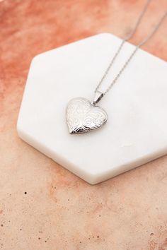 The Love Me Heart Heart Locket Necklace is the perfect way to show someone you care. Available in gold and silver, this cute necklace is a perfect gift for any occasion. Spread love and happiness with this adorable accessory. #lovemyleto #completeyourlook 100% Stainless Steel Imported Gold Locket Necklace, Heart Locket Necklace, Love And Happiness, Novelty Clothing, Bull Skulls, Skull Necklace, Stone Pendant Necklace, Cute Necklace, Heart Locket