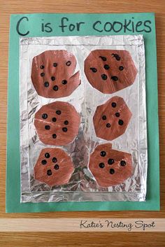 a paper plate with cookies on it and the words c is for cookies written in black